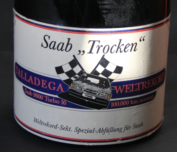 Saab-9000-Weltrekord-Sekt-100000-km-Talladega-USA-1986-Werbesekt-Henkel.jpg